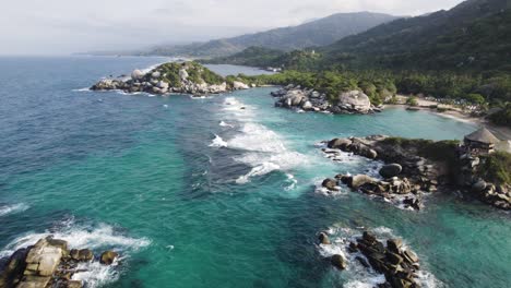 aerial establishing shot of the tropical rocky coastline at cabo san juan