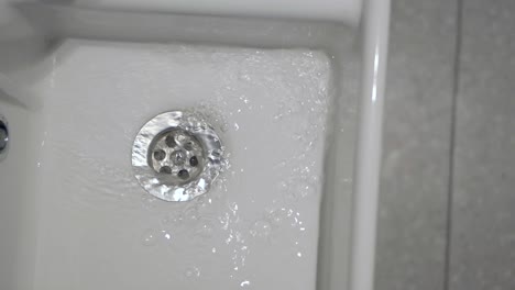 water draining into sink drain