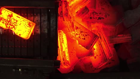 close-up of red-hot metal blocks during industrial heating in a metalworking process.industrial metalworking processes.