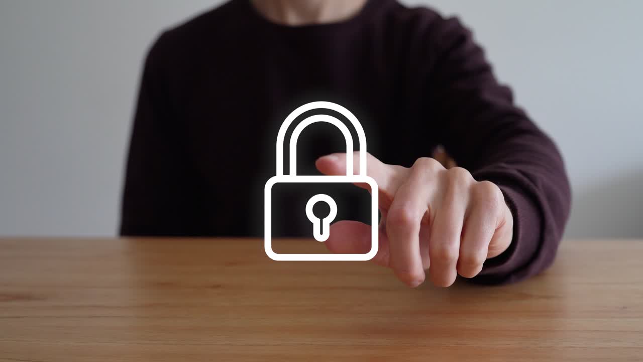 Person's Finger Tap The Security Lock Icon. - closeup shot