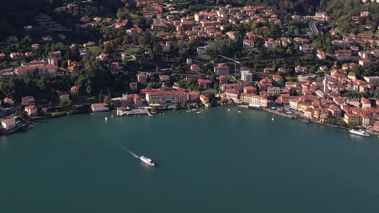 Stunning aerial view of an Italian lakeside village surrounded by Alps