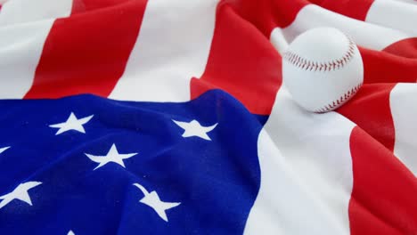 baseball falling on an american flag