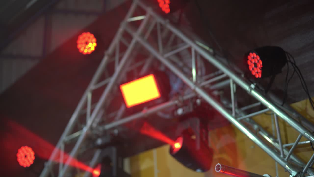 Colorful light led in scene stadium concert on night party, multicolor abstract box light for entertain, spotlight on stage show, red purple and orange bright color rays on event