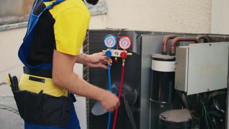 technician looking at refrigerant levels