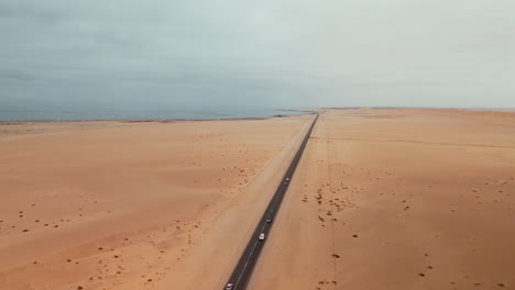 desert road and ocean coastline aerial view