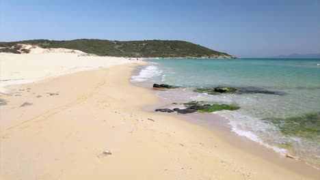 slow motion video of waves crushing unto a tropical beach in greece