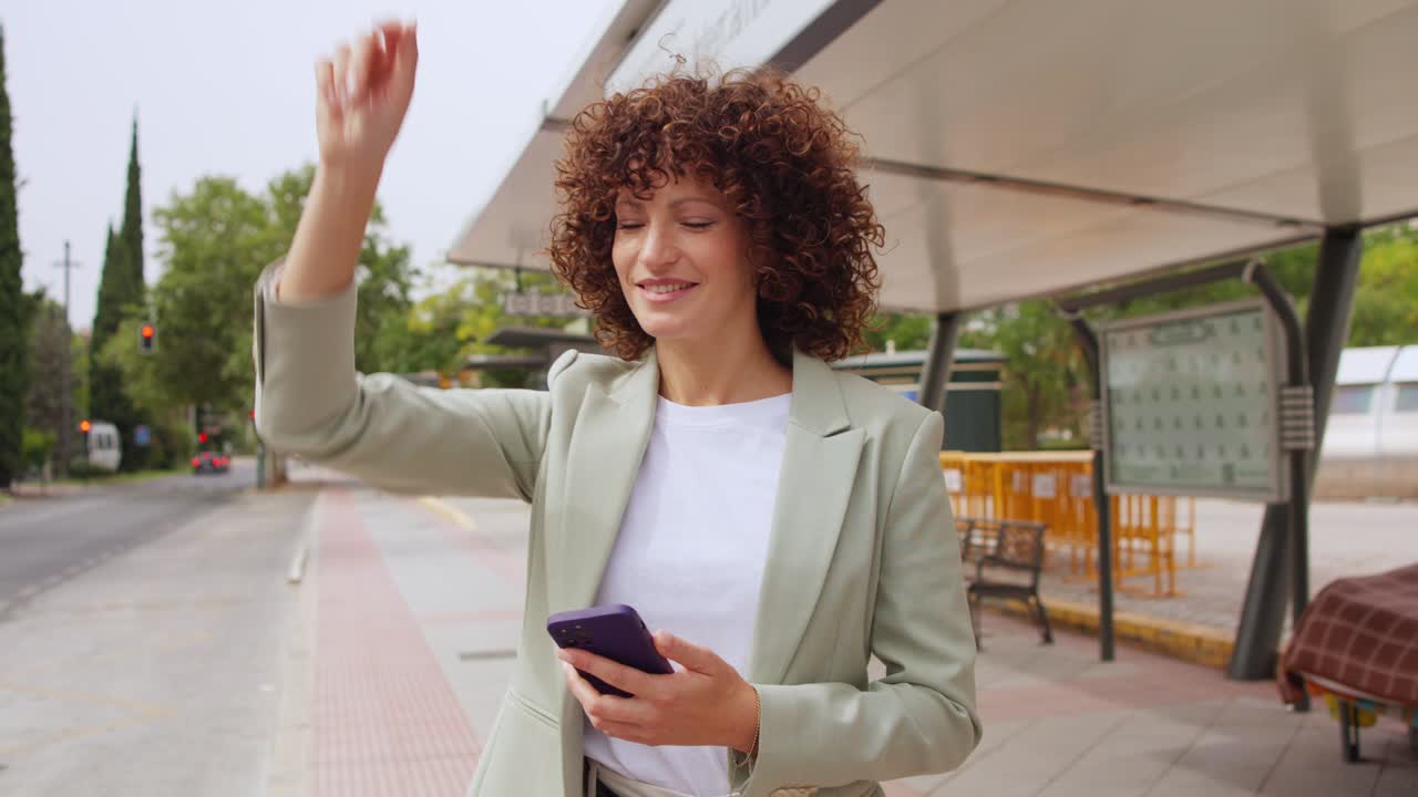 Woman waiting at a bus stop