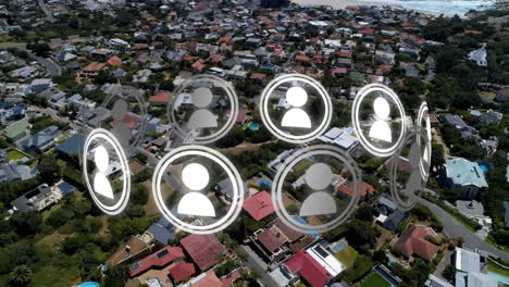 animation of ring of people icons rotating over aerial view modern buildings