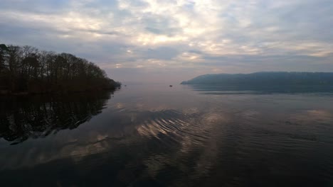 misty scene over lake windermere in the english lake district national park