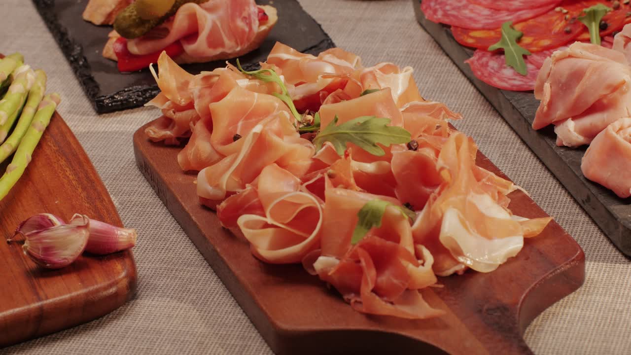 Italian or Spanish restaurant with traditional tapas food, Spanish cuisine, delicious tapas and cheese plate, bruschetta with cheese, olives dry tomatoes and tasty sandwich bar appetizer, buffet