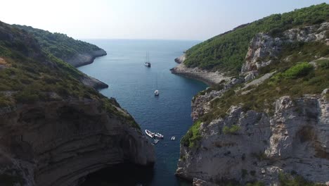 steep coastal cliffs conceal a secluded beautiful beach in croatia