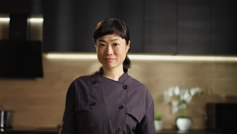 Portrait of an Asian Woman Chef in Kitchen