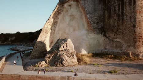 rock by the sea in greece