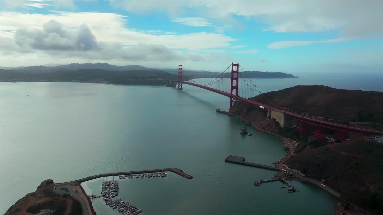 San Francisco Golden Gate Bridge aerial drone California Point Cavallo Needles Rock Horseshoe Bay Area Dana Bowers Vista Point cloudy mist misty fog blue skies Sausalito cars traffic forward pan up