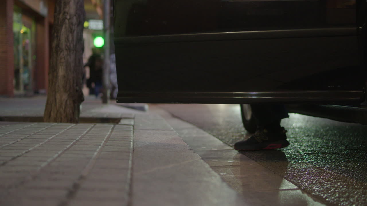 City Street at Night - Person Getting Out of Taxi