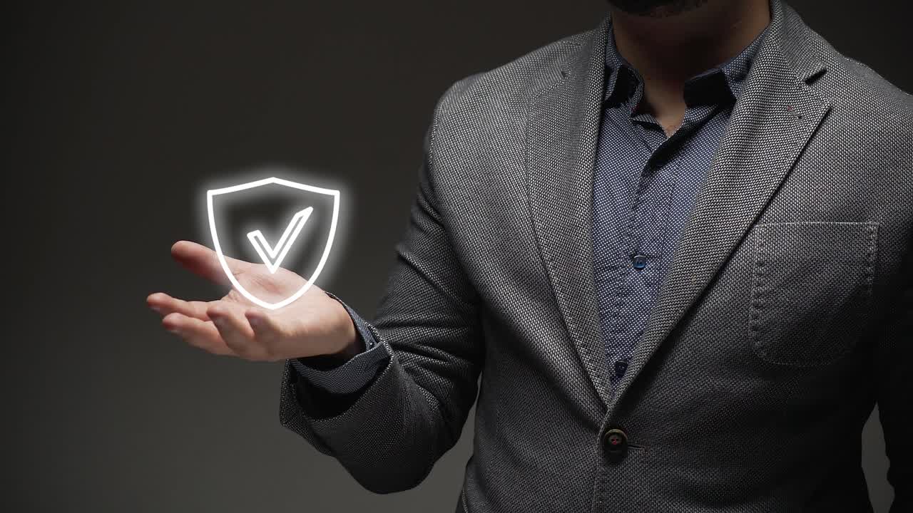 security concept. a business person teaches virtual shield hologram