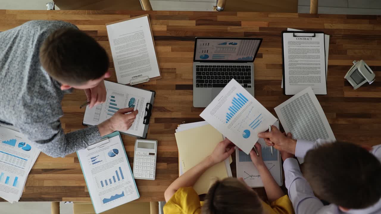 Business meeting with financial analysis