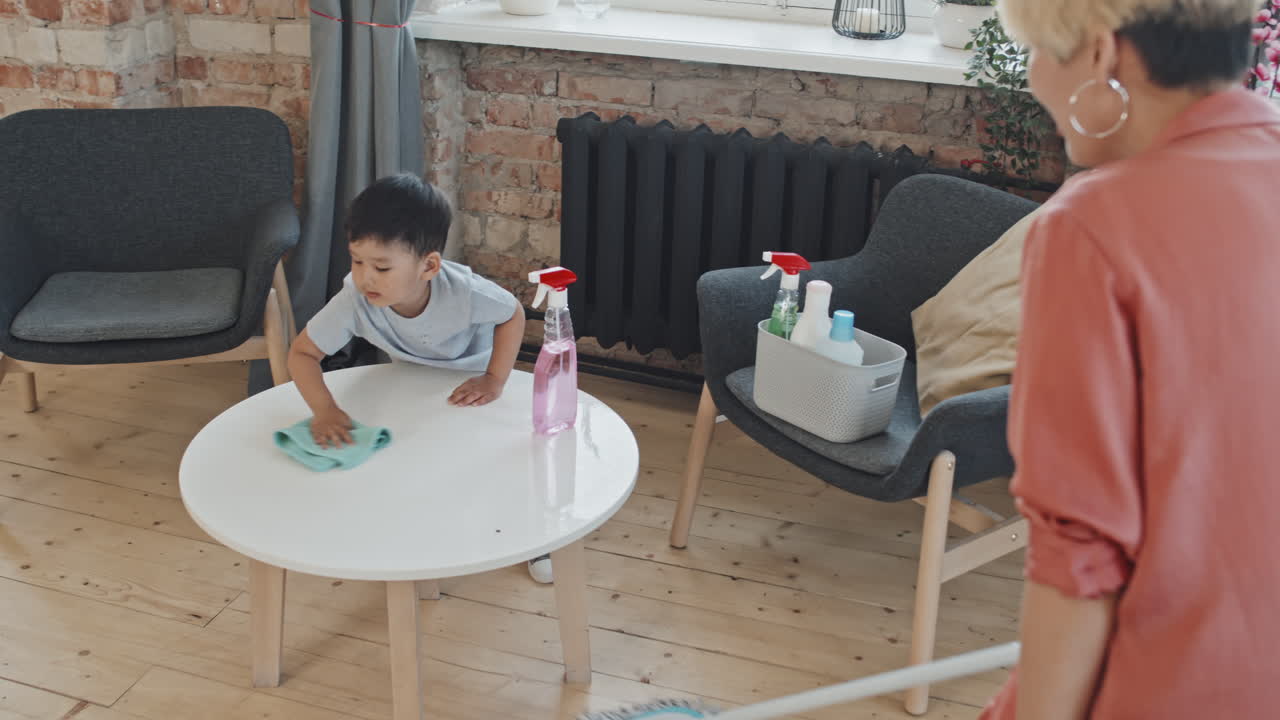 Asian Boy Helping Mom with Cleaning