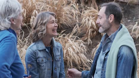 mature people talking next to a rural path