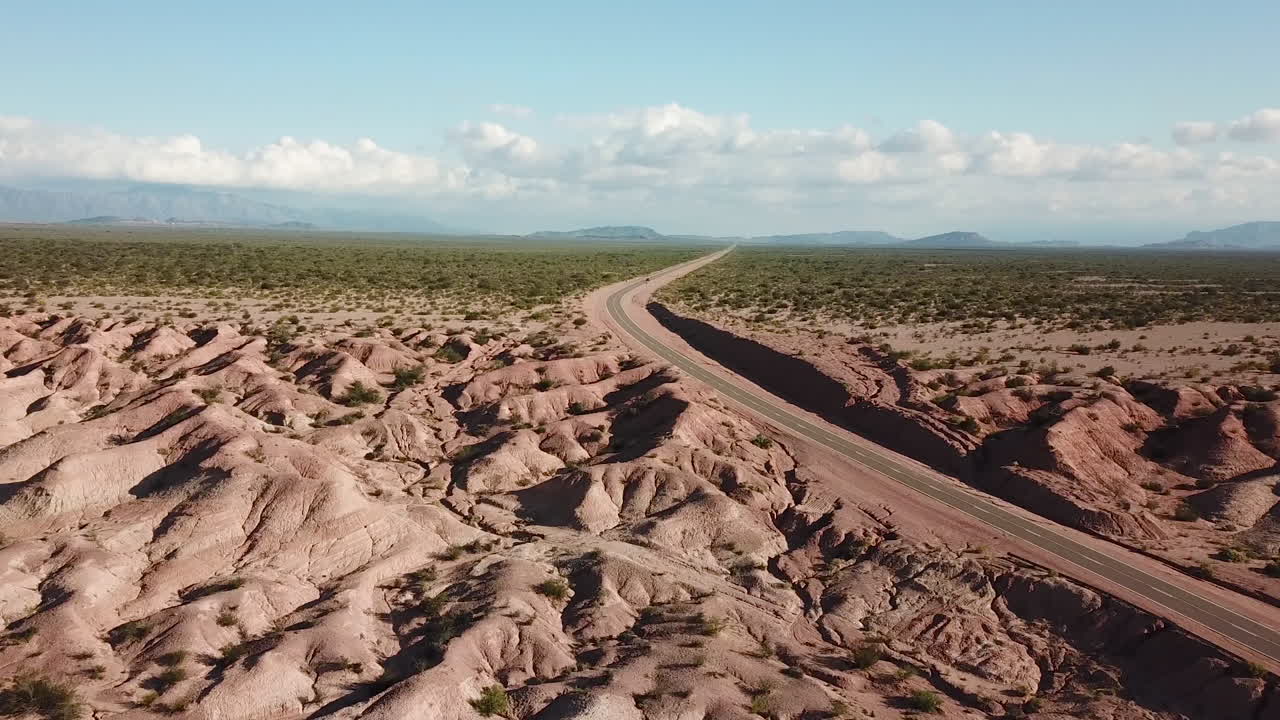 Aerial View of Dr Desert Landscape and Freeway Road in Middle of Nowhere With Endless Skyline