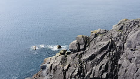 magnificent rocky cliffs on the dingle peninsula coast in ireland, aerial