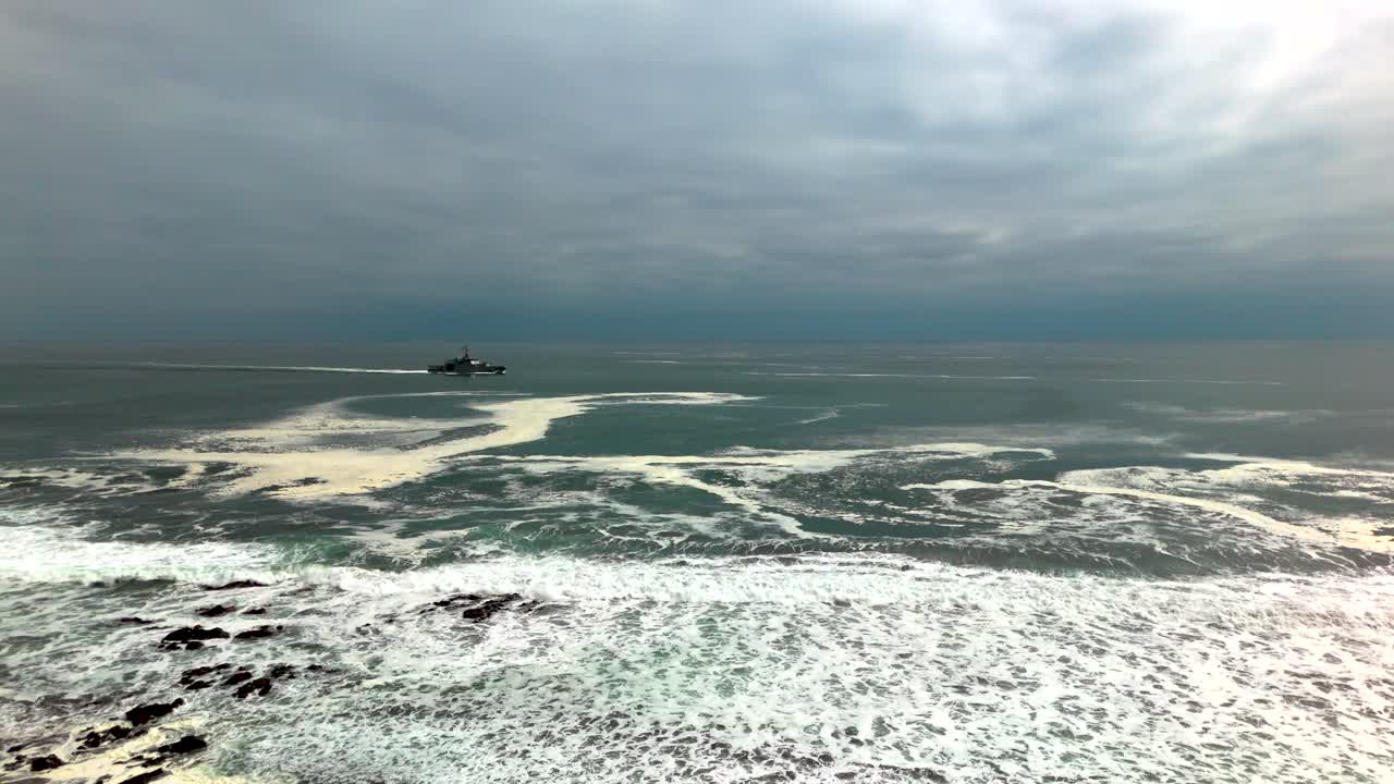 Huayquique beach Chile Iquique building ocean sea traffic tarapaca mountain ocean sea foam boat ship static