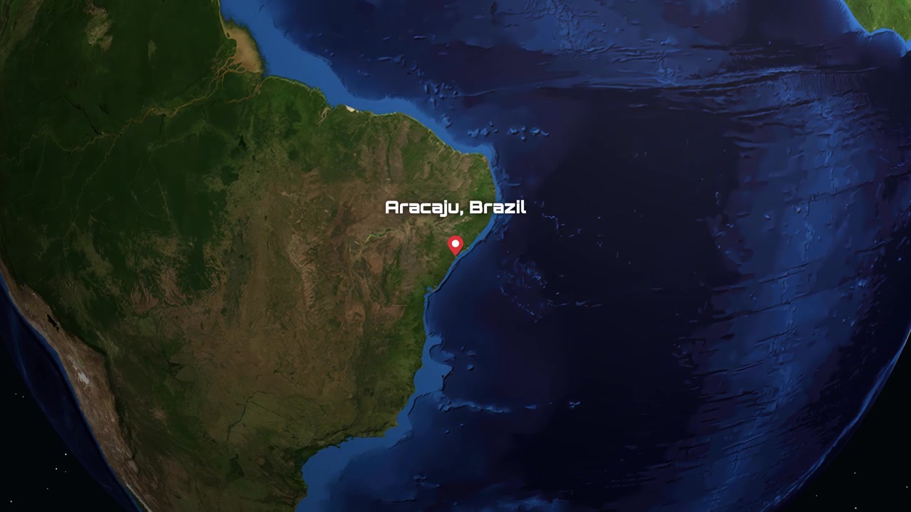 La perspectiva satelital se acerca desde el espacio exterior a Sudamérica, señalando Aracaju, Brasil con texto