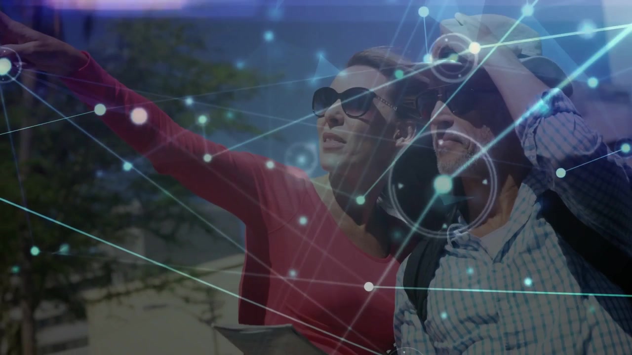 Woman pointing tablet and starting travel map HUD nearby, man shading eyes and locating landmark