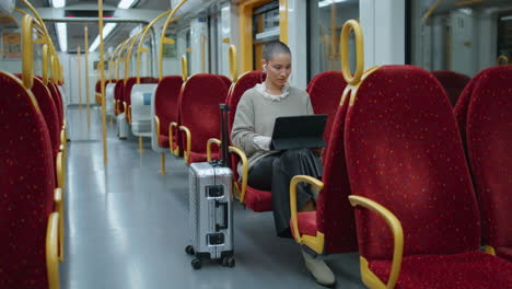 woman working on tablet on subway