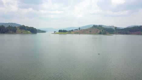 Calm-Waters-Of-Lake-Bunyonyi-In-Uganda,-Africa---aerial-drone-shot