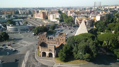 Cinematic-Drone-Flight-Above-Pyramid-and-Porta-San-Paolo-in-Rome,-Italy