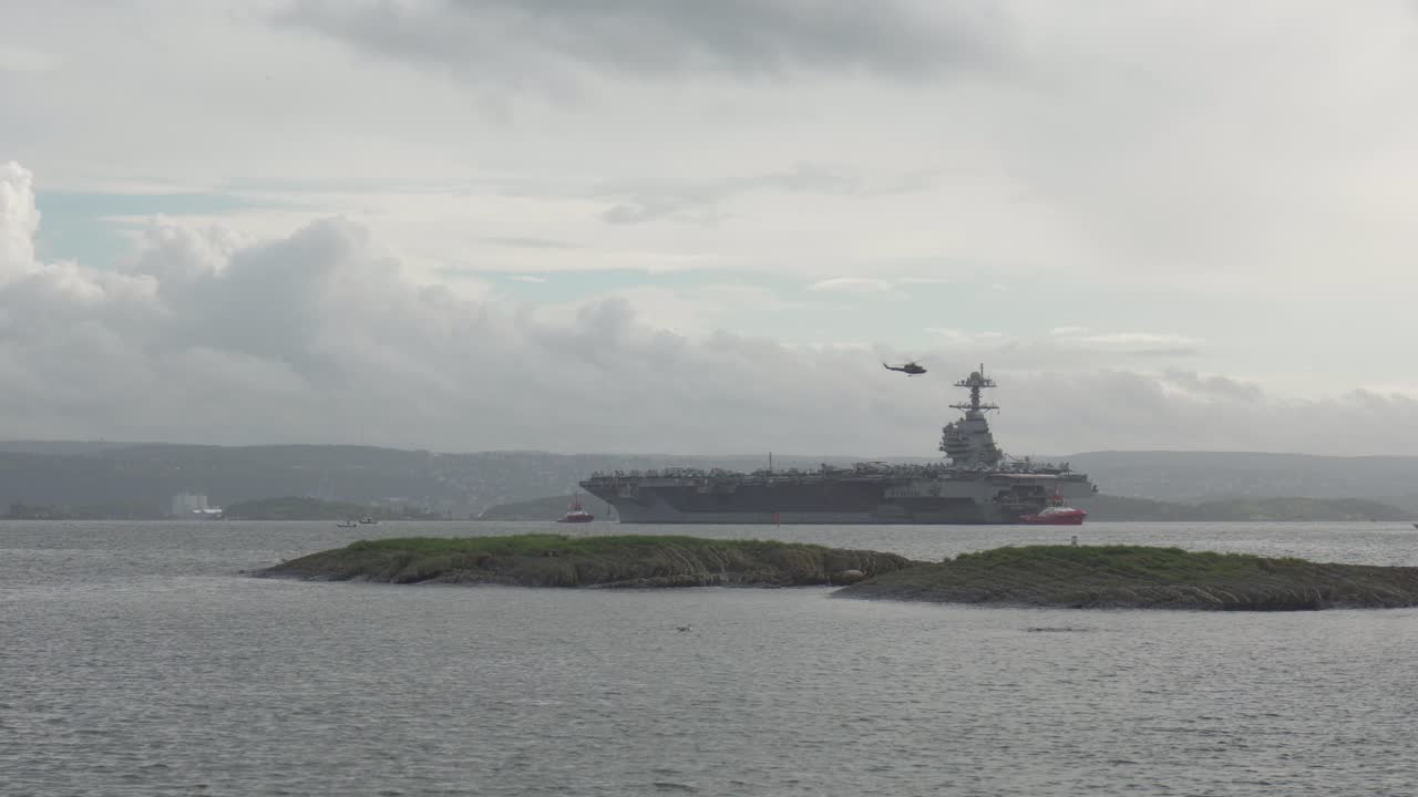 Helicopter Fly Over The USS Gerald R. Ford In Oslo Fjord, Oslo, Norway. - wide shot
