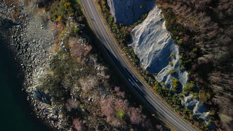 Top-down-view-of-road-to-Kyle-of-Lochalsh-with-traffic-and-rugged-coastline-inScottish-Highlands