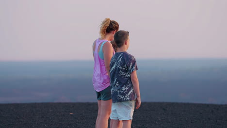 family enjoying a scenic overlook at dusk or dawn
