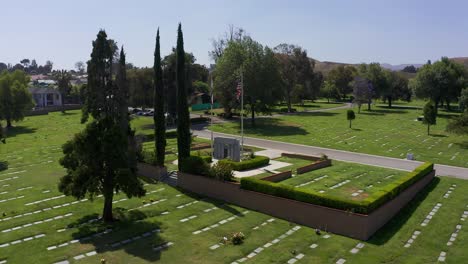 low aerial push-in shot of a veteran's war memorial at a mortuary in california