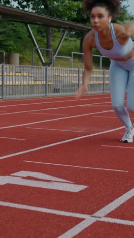 woman preparing to run on a track