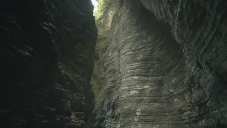 exploring shot of mystery rocky canyon, sunlight shining through rocks