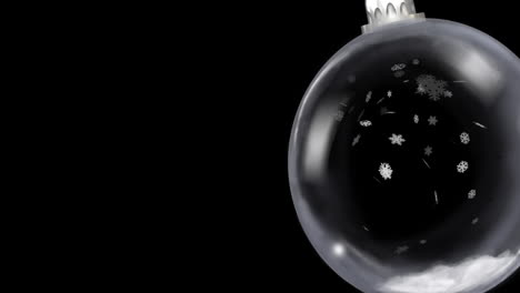animación de la joya de navidad colgando sobre la nieve cayendo sobre un fondo negro