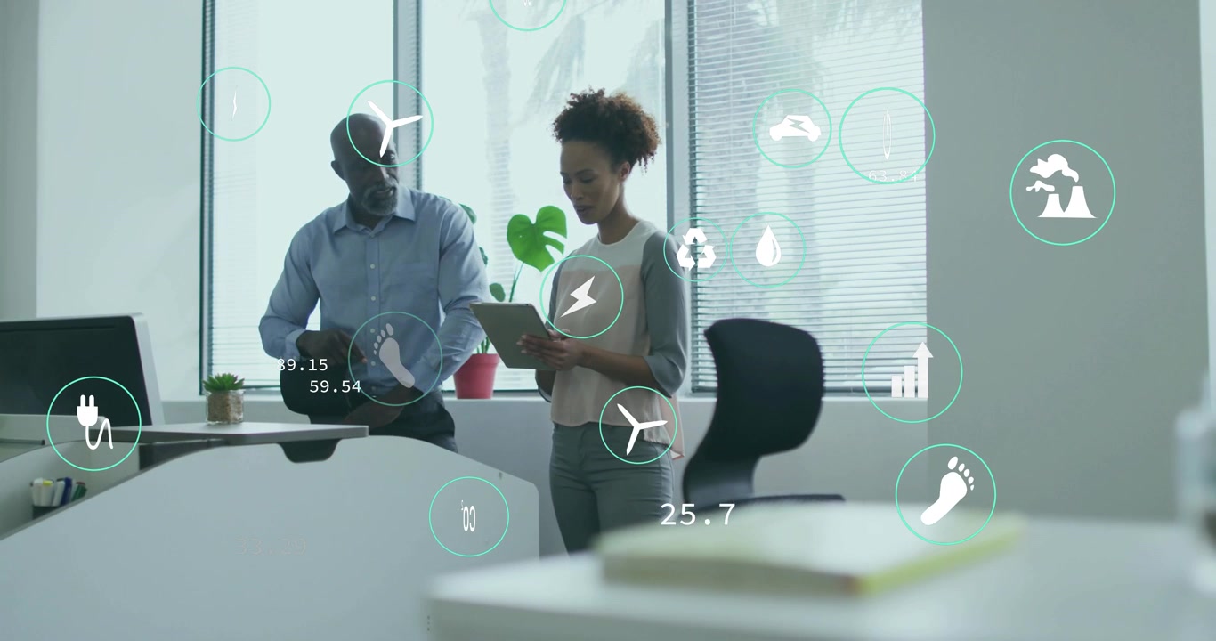Male colleague tapping cycling icons, female coworker swiping tablet evaluating sustainability data
