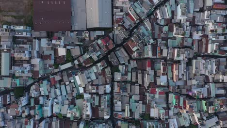 rooftop view over buildings to timber waiting to be exported at port area along the saigon river in ho chi minh city, vietnam