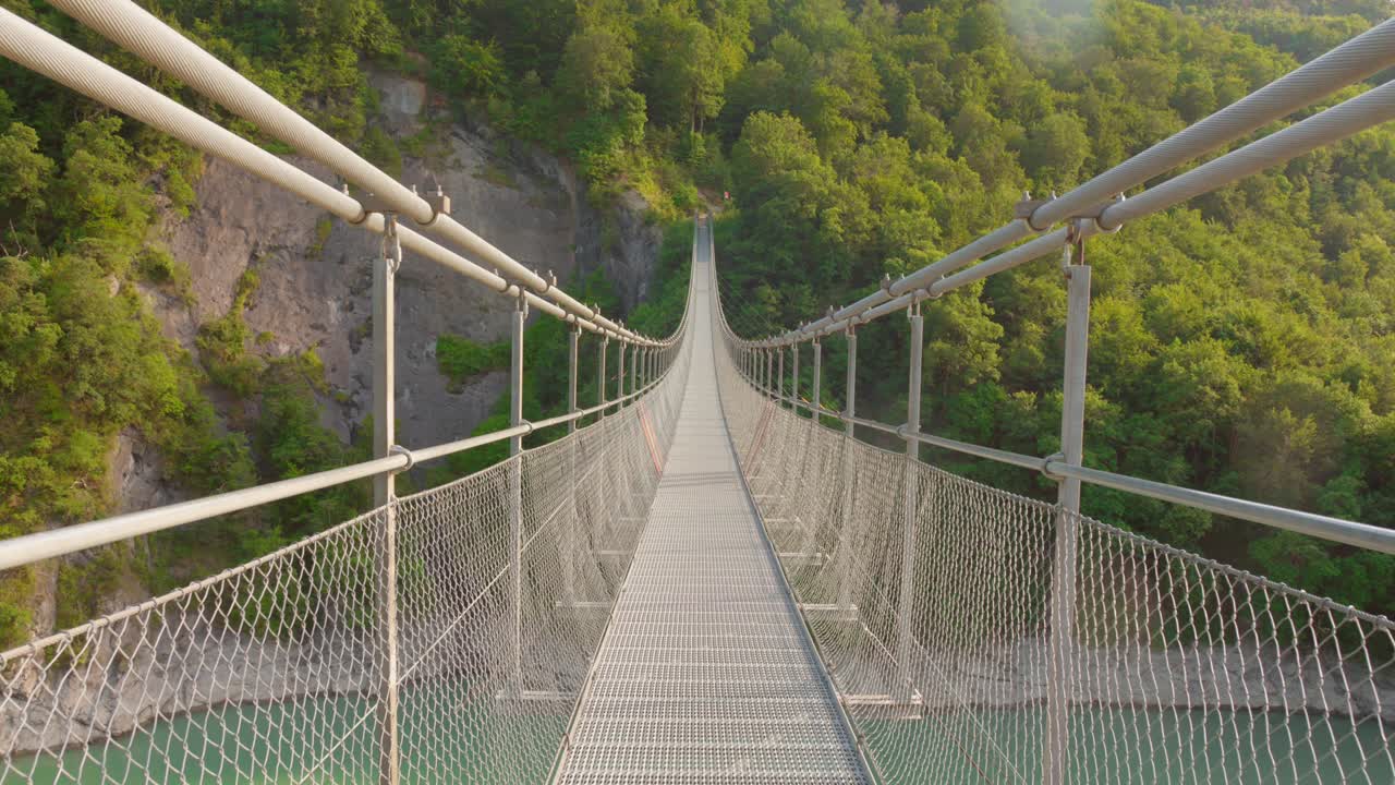 Himalayan Style Suspension Bridge Over Drac River In Auvergne-Rhône-Alpes, France. Wide shot