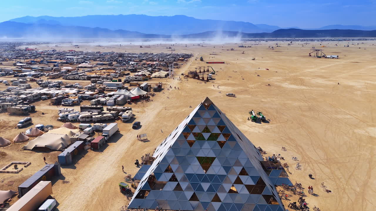 Nevada, USA, 14 August 2025: Art Pyramid Installation at Burning Man. Aerial view of the geometric pyramid art structure in the desert