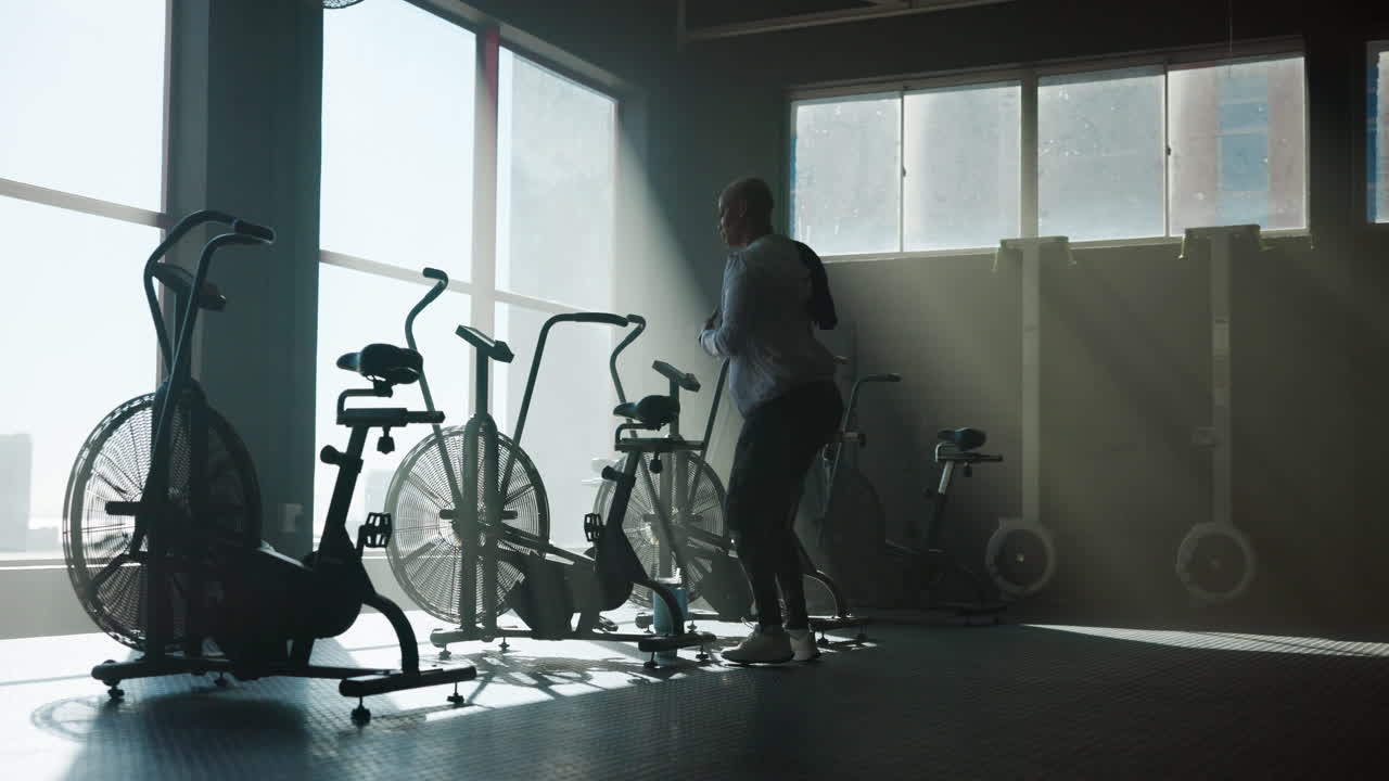 Gym with exercise bikes and people