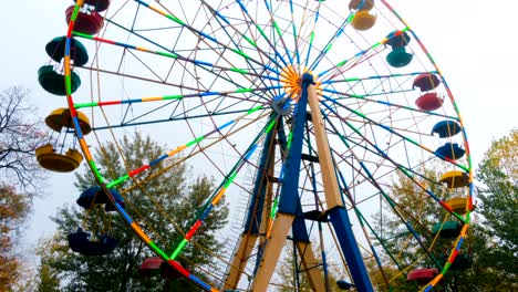 front view of running illuminated colourful ferris wheel