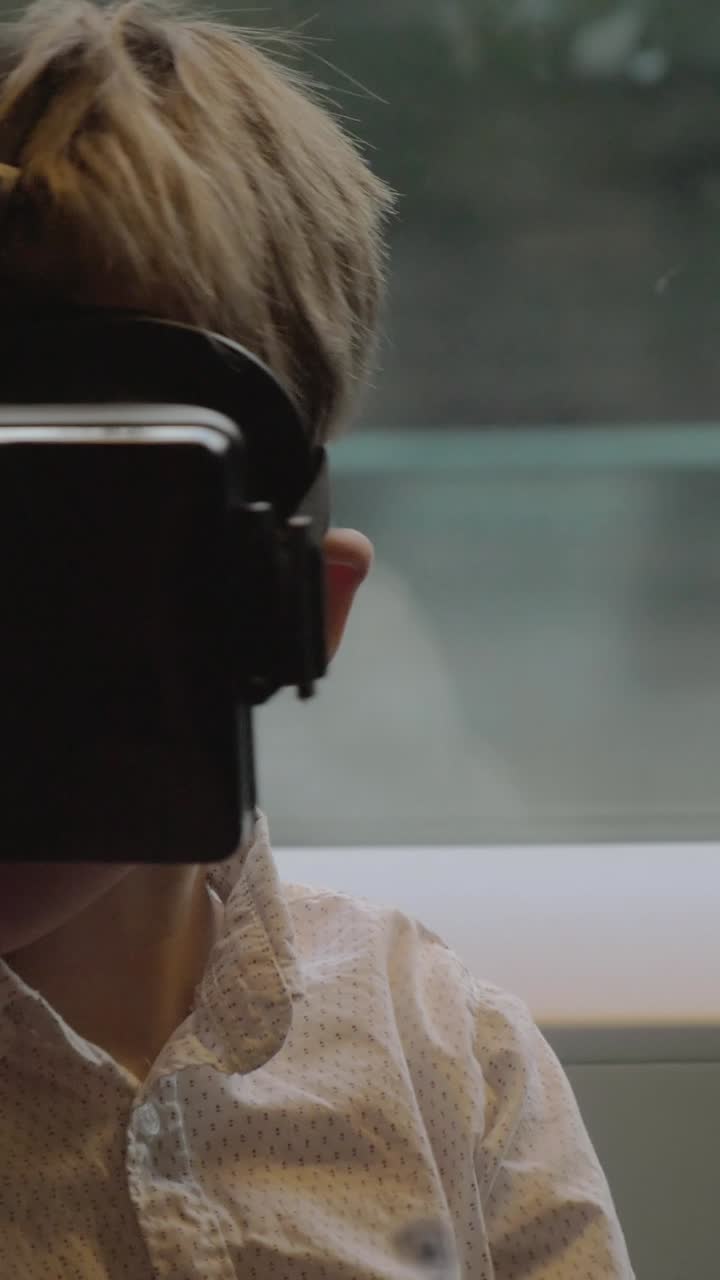 Young Boy Experiencing Virtual Reality with a VR Headset