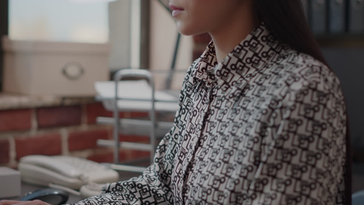 Close up of business woman typing on computer keyboard