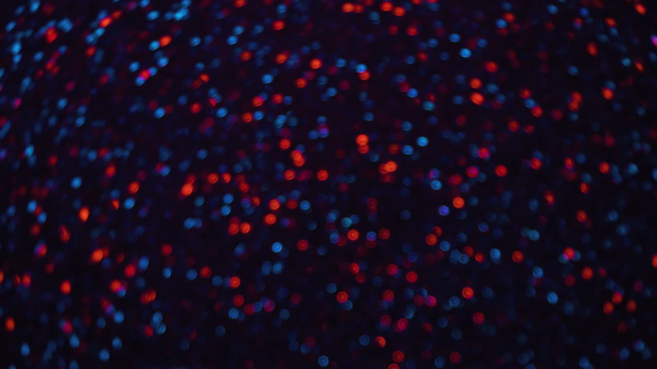 partículas de bokeh azules y rojas que parpadean rápidamente