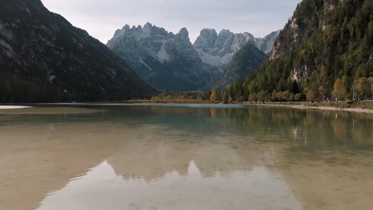 Aerial view of mountain peaks during sunrise in the Dolomites, Italy