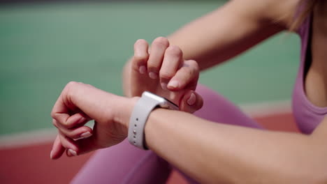 woman checking smartwatch