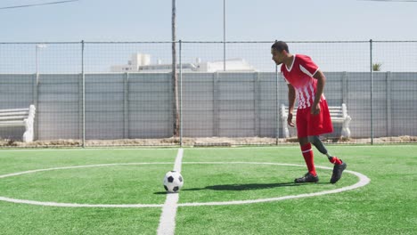 soccer player with prosthetic leg on field